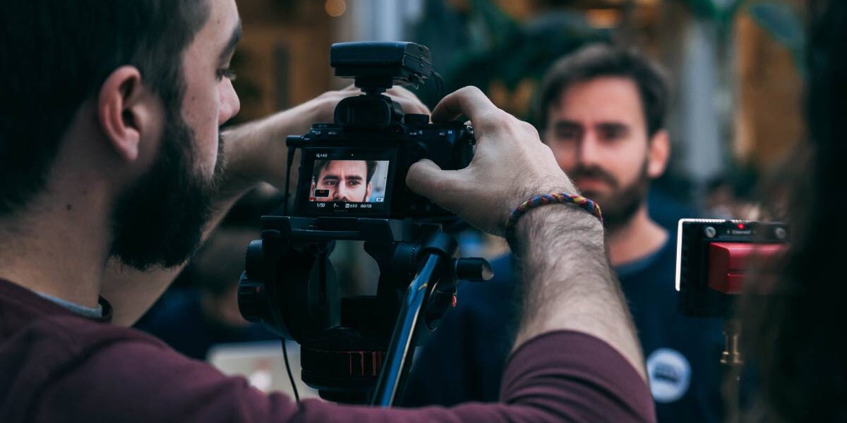 Cameraman filming an interview.