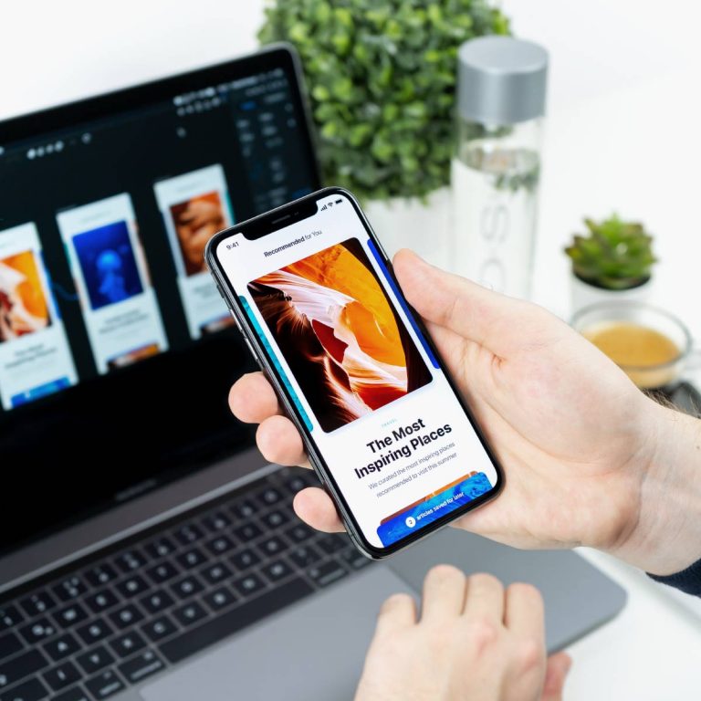 Person holding phone showing travel app.